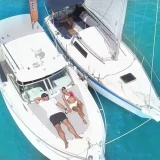 Couple enjoying sunbathing on yacht
